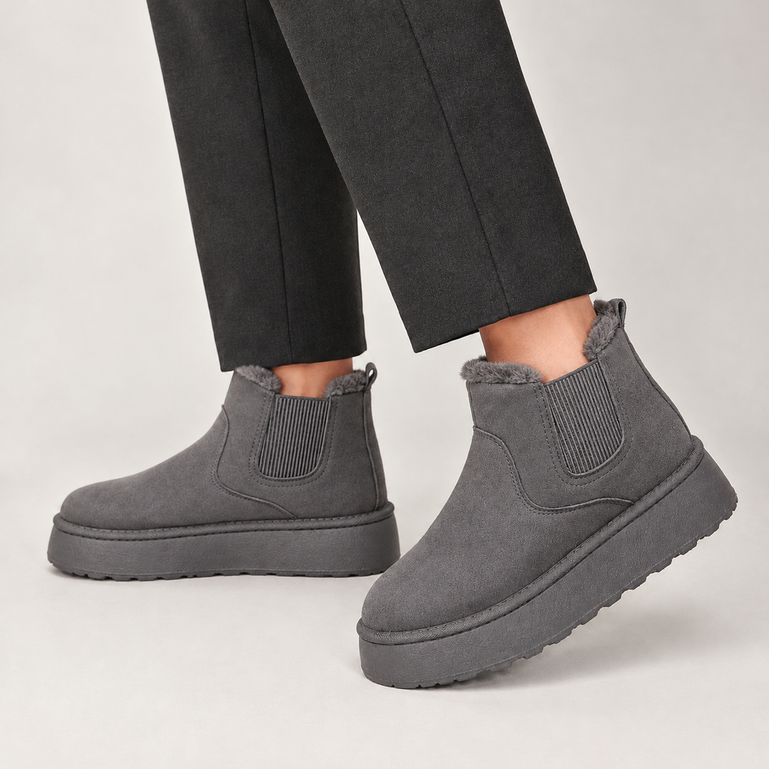 Side view showing the upper, side panel and platform sole, grey