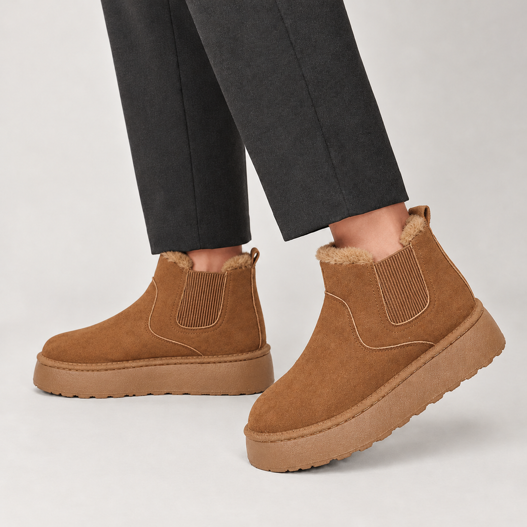 Side view showing the upper, side panel and platform sole, brown