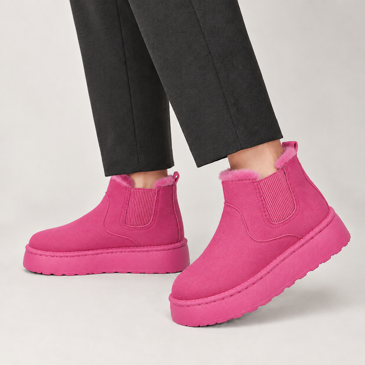 Side view showing the upper, fleece lined collar and platform sole, rose red