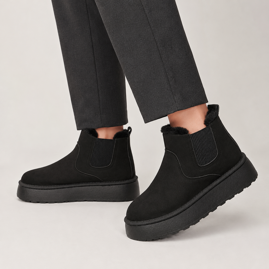 Side view showing the upper, side panel and platform sole, black