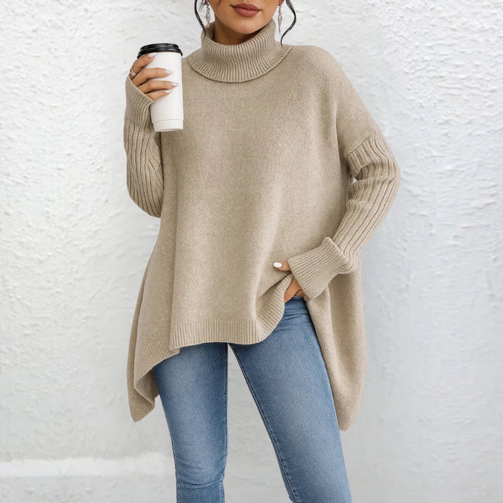 Front view showing turtleneck and ribbed sleeves, beige
