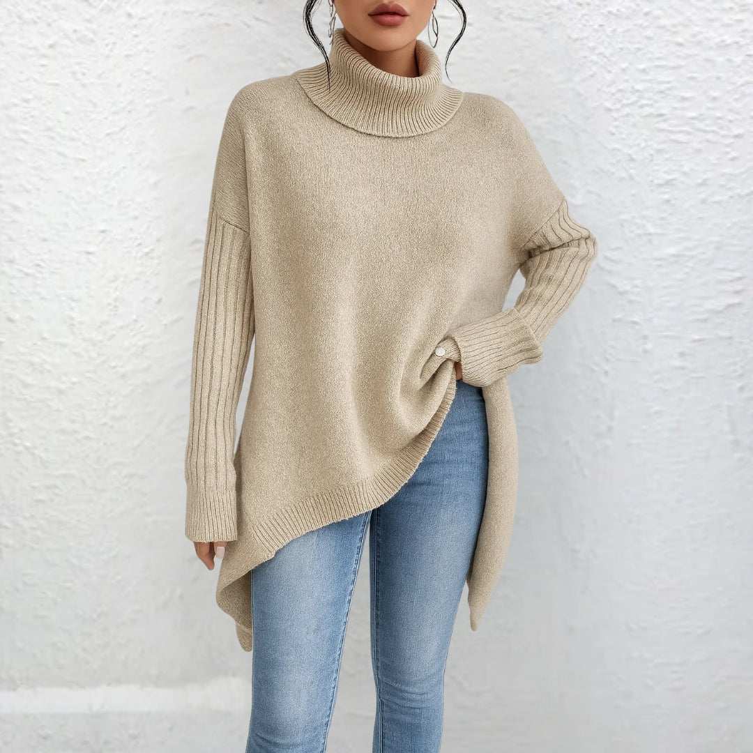 Front view showing turtleneck, banded cuffs and asymmetric hem