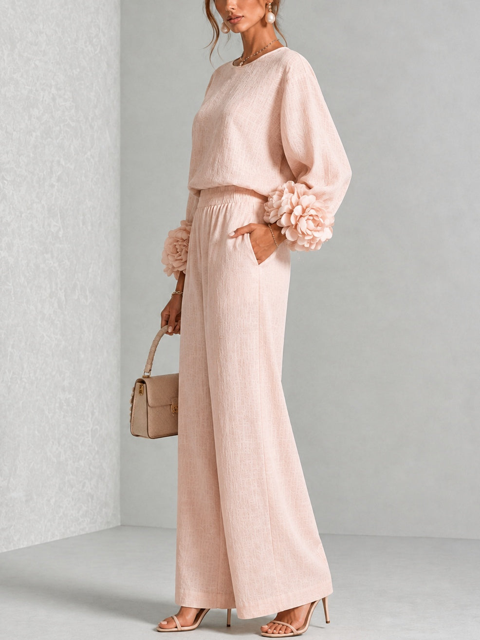 Side view of long sleeves, floral cuffs, banded waist and wide legs
