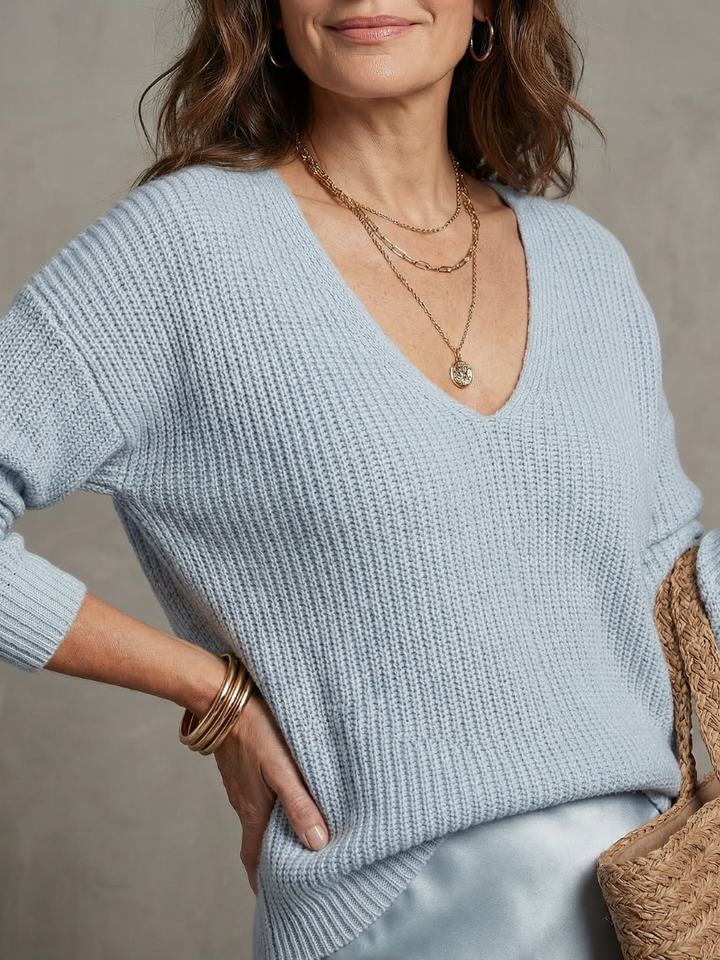 Detail view of v-neckline and dropped shoulder seams