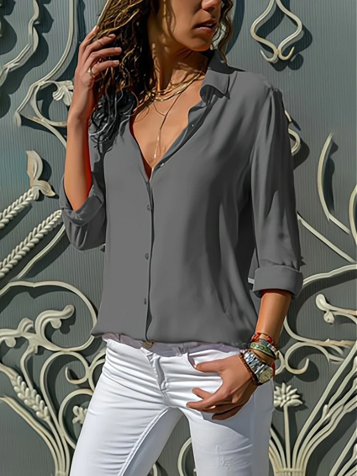 Front view of blouse showing shirt collar, button placket and long sleeves, grey