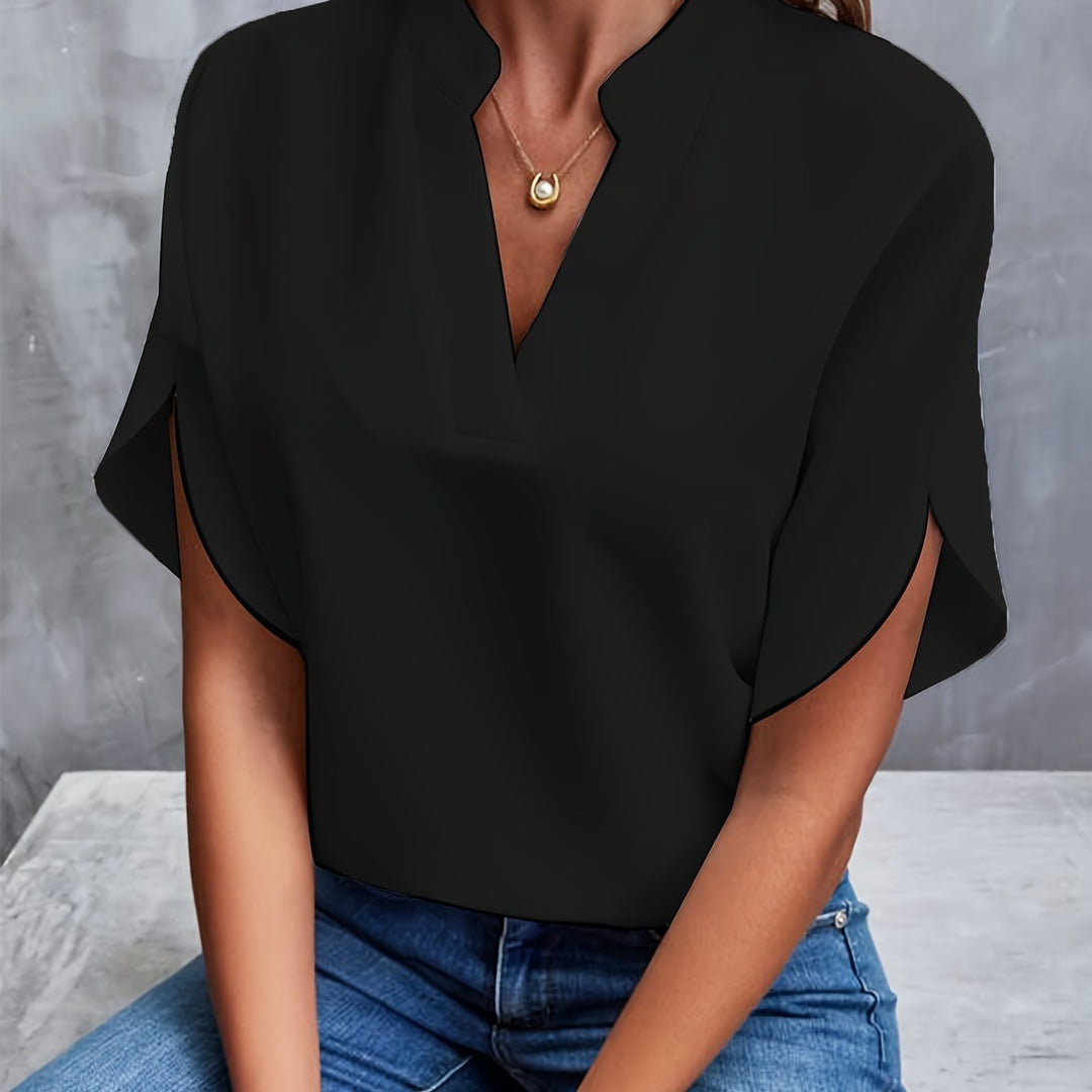 Front view showing v-neckline and stand collar, black