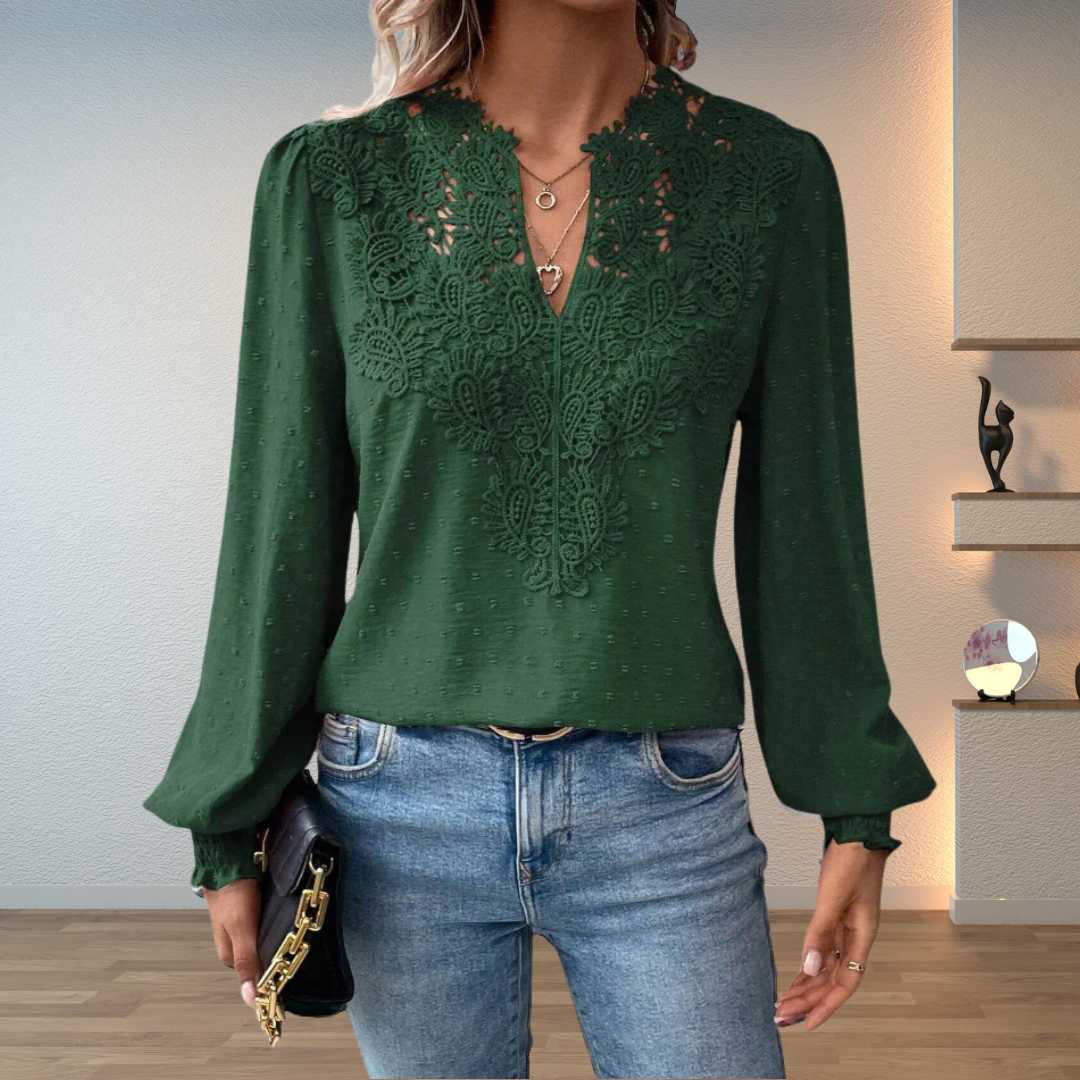 Front view showing v-neckline with lace panel and banded cuffs, green