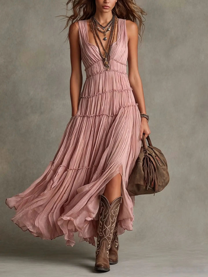 Front view showing deep v-neckline, pleated bodice and tiered skirt, pink