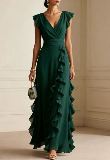 Front view of v-neckline, wrap front and ruffle skirt, emerald green