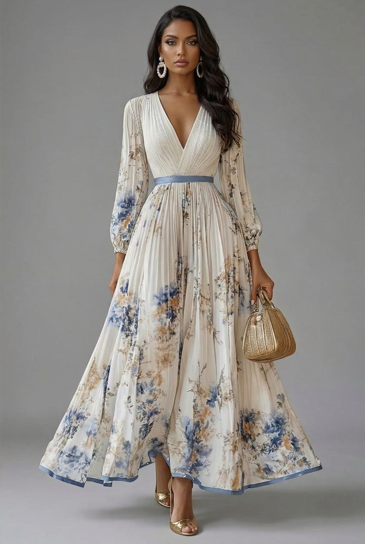Front view of maxi dress with v-neckline, long sleeves and pleated skirt, white