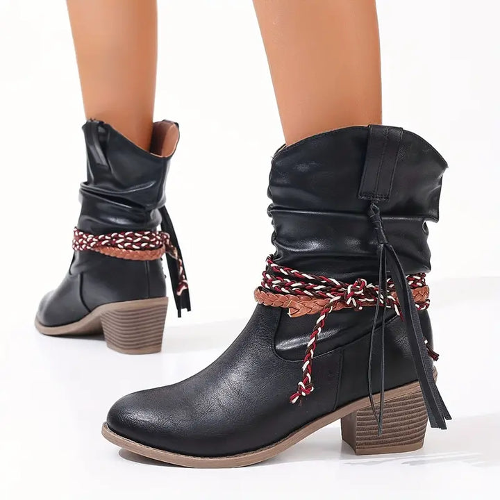 Back view of stacked block heels with braided wraps and tassels at the ankle