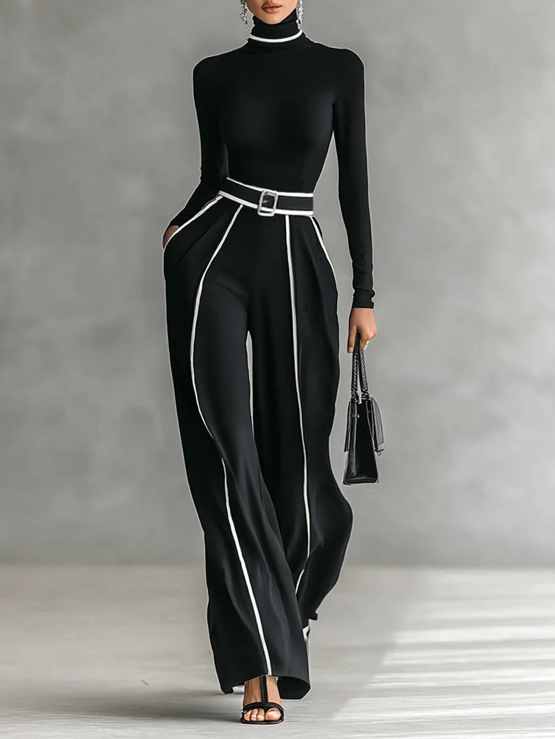 Front view of turtleneck jumpsuit with long sleeves, belted waist, side pockets and wide legs, black