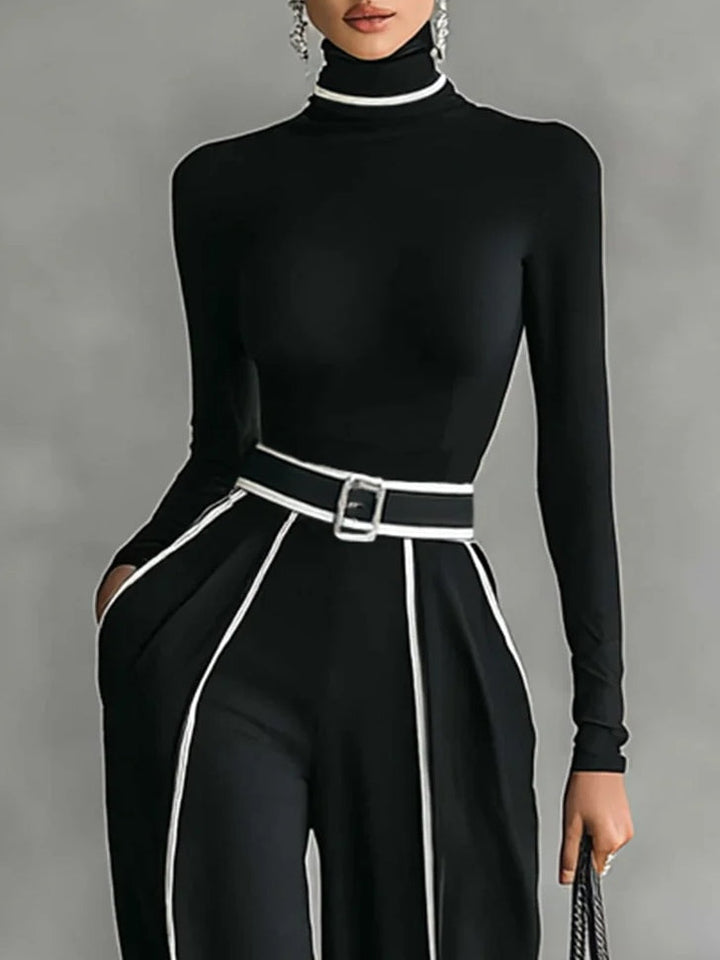 Detail view of turtleneck, belt with buckle and side pocket