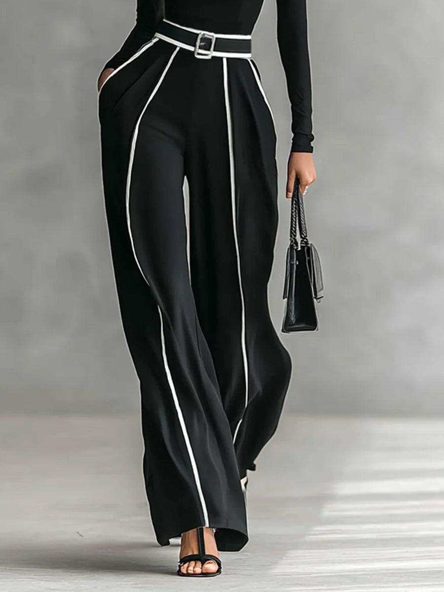 Front view of belted waist, side pockets and wide legs