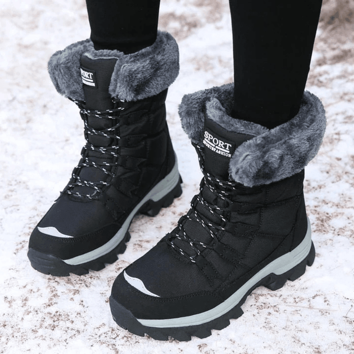 Front view showing lace-up front, fold-over collar and toe cap, black