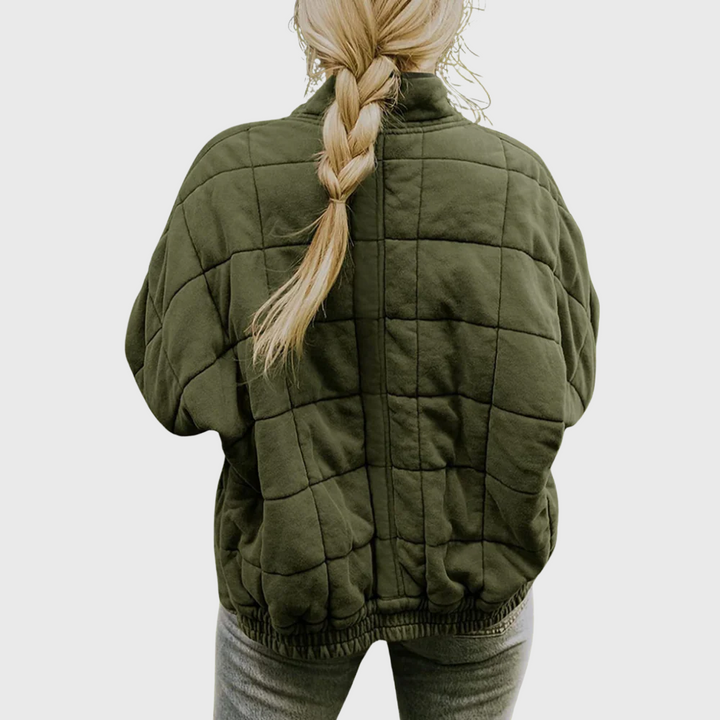 Back view showing quilted back, banded waist and dropped shoulder seams